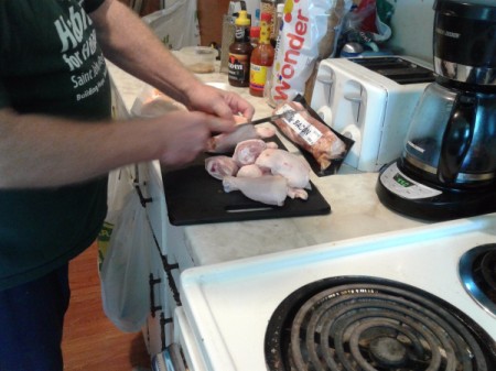cutting chicken pieces