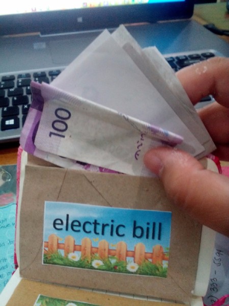 Budget Organizer Notebook - place bills, receipts, and cash to pay into each envelope