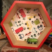 Honeycomb Hexagon Personalized Shelf - truck motif shelf with a toy inside
