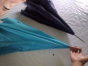 Avoid Lightning Strikes with Plastic Tipped Umbrella - hand under plastic tip