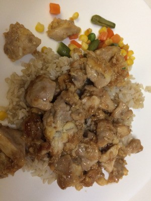 sesame chicken on rice with vegetables