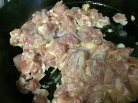 coated chicken in pan