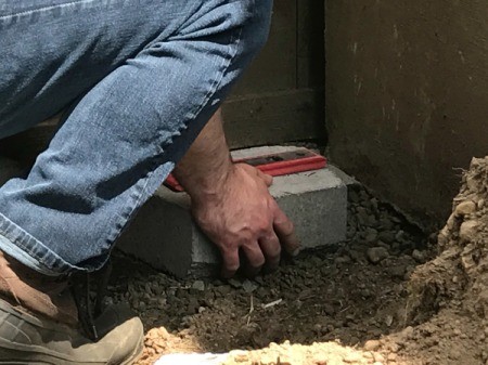 Stacked Block Stairs - begin laying first row of blocks leveling as you go