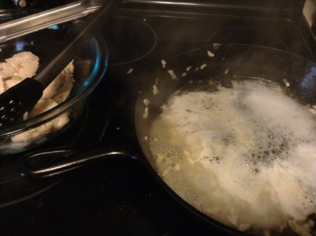 Adding champagne to deglaze pan.
