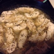 Simmering the chicken in the champagne mixture.