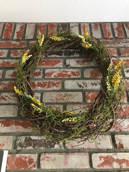 A wreath with living air plants.