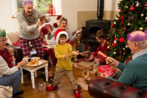 A large family exchanging Christmas gifts.