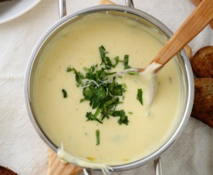Cheese soup cooking in a pan.