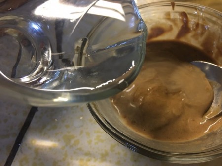 adding water to peanut sauce