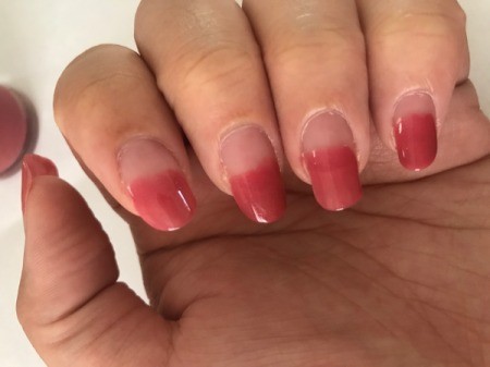Nails painted halfway, ready for French tips.