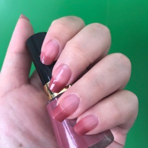 Nails manicured with French tips in a berry color.