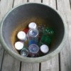 Place Empty Bottles in Garden Pot - planter with plastic bottles in bottom