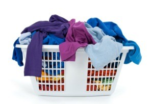 A laundry basket full of clothing.