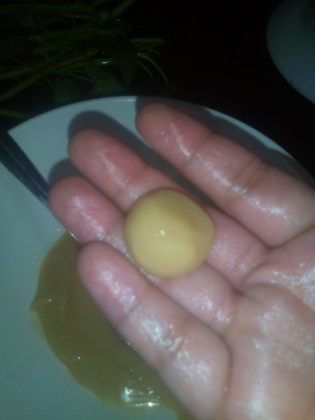 formed Milk Candy Ball in hand