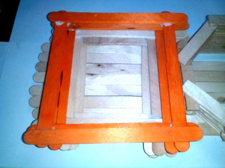 Mug Holder with Goody Compartment - Now attach another set of whole Popsicle sticks on the left. Stack them forming layers of square.