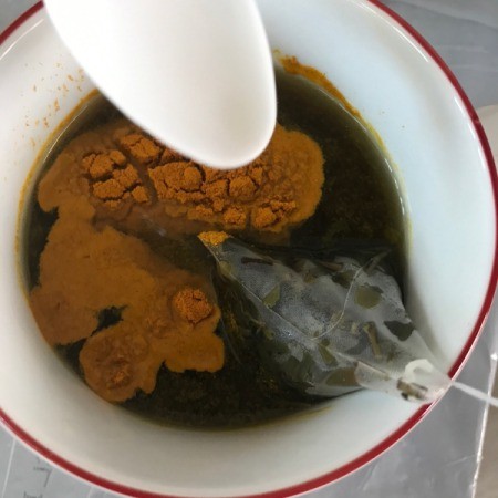 tumeric added to tea mug