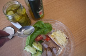 Pickle Jar vinegar spooned onto plate of veggies