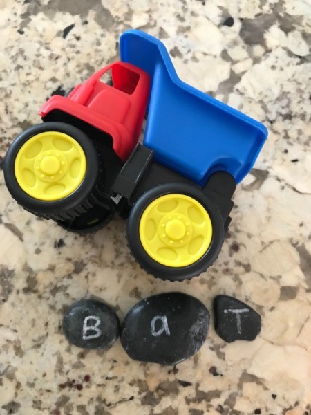 Alphabet Rocks - dump truck and rocks spelling out "bat"