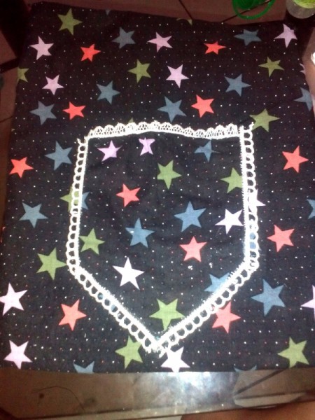 Pouch Made of Old Mini Dress - polo the piece into a pocket shape and glue in place, use lace from hemline of dress to add more around the pocket