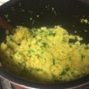 parsley added to Curried Cauliflower Rice in pan