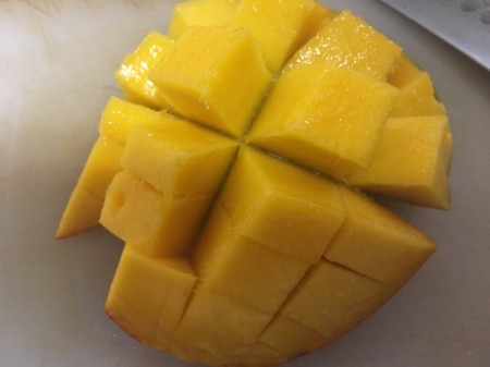 sliced mango still attached to skin