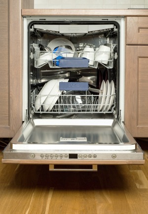 A dishwasher with the door open.