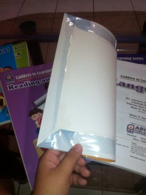 A book protected with a plastic cover.