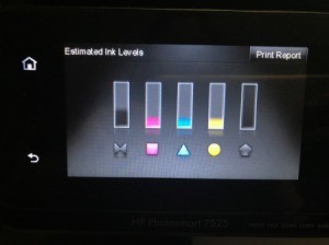 A printer showing ink levels on five cartridges.
