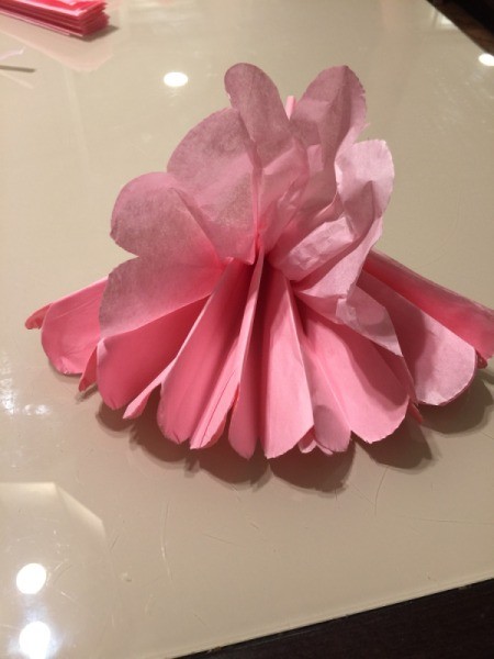 DIY Tissue Paper Pom Pom Decoration - begin fluffing one side of pom