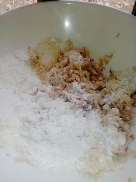 adding dry ingredients to fish