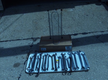 CD/DVD Rack Tool Organizer - wrenches lying on the ground of sorting