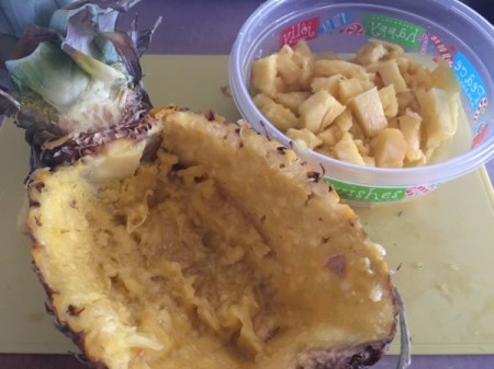 cut Pineapple in container & cleaned out pineapple 1/2