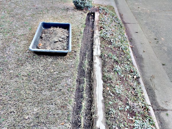 Sunken Gutters For Flower Border Containers - trench where gutter has been lifted