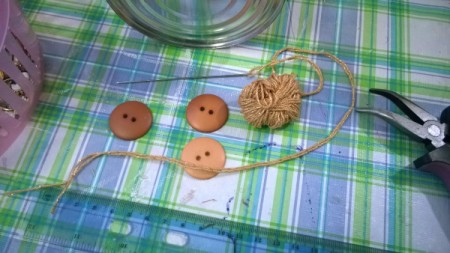 Tin Can Organizers - thread crochet cord through the buttons