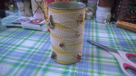 Tin Can Organizers - sparkly paper, lace, and jewelry on this one