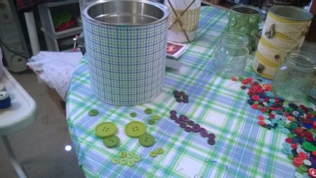 Tin Can Organizers - paper wrapped coffee can with green and purple buttons lying next to it