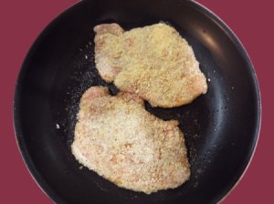 Pork chops dredged in panko breadcrumbs.