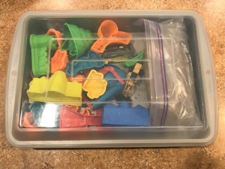 Lidded Cake Pan for Kinetic Sand - closed pan with toys and sand inside