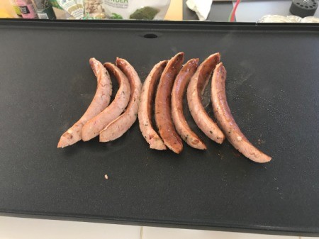 cooking sausage on grill