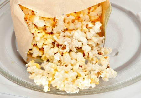 Microwave popcorn being made.