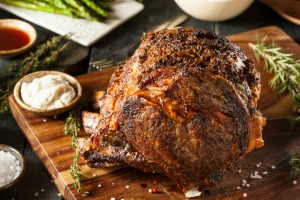 A perfectly cooked beef roast on a cutting board.