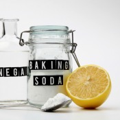 A jar of baking soda and a bottle of vinegar.