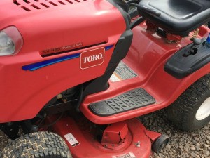 A red Toro riding mower.