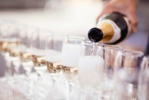 Serving champagne at a wedding reception.