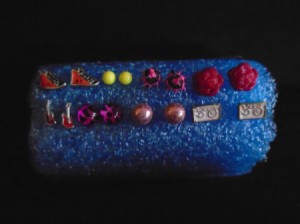 Pool Noodle as DIY Earring Holder - earrings attached to cut pool noodle