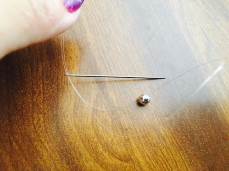 Drinking Straw Geometric Earrings - put one bead onto the thread and then put both ends of the thread through the needle
