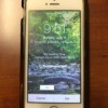 An iPhone with contact information displayed on the lock screen.