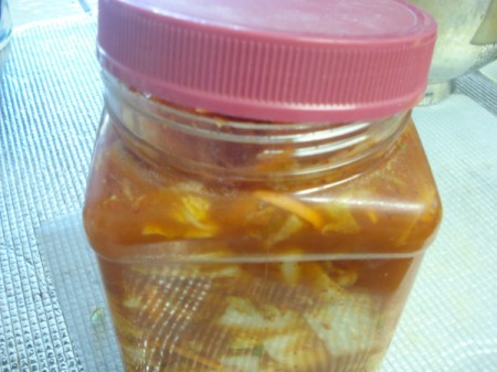 Homemade Kimchi in jar slightly open