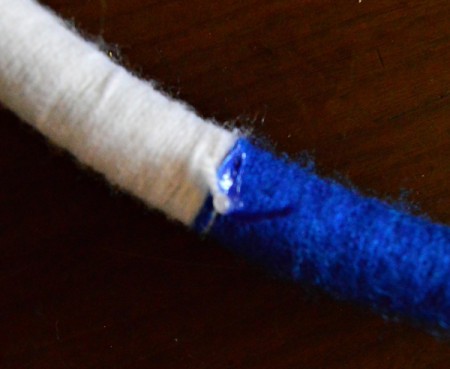 Blue Ombré Holiday Wreath - add hot glue to knots on yarn and allow to dry before cutting off excess