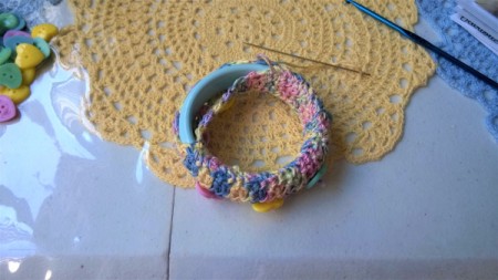Crochet Covered Bangle - continue stitching around and then readjust to have buttons on top